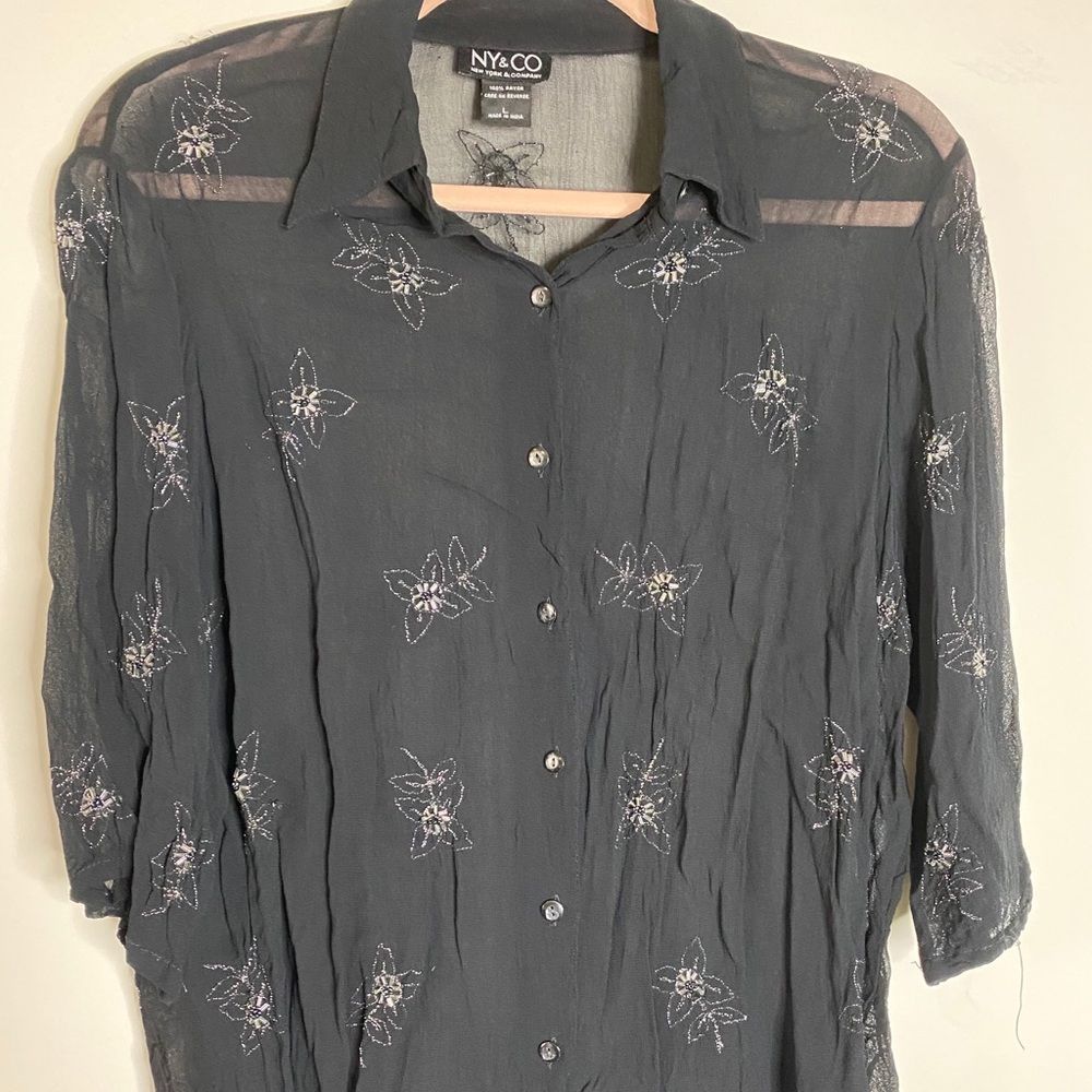 Black top, silver thread embellishment.